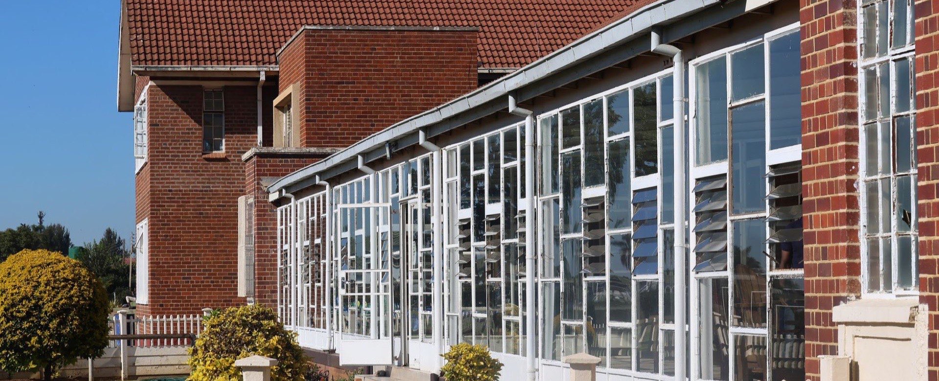 Exterior of a glass-fronted school building